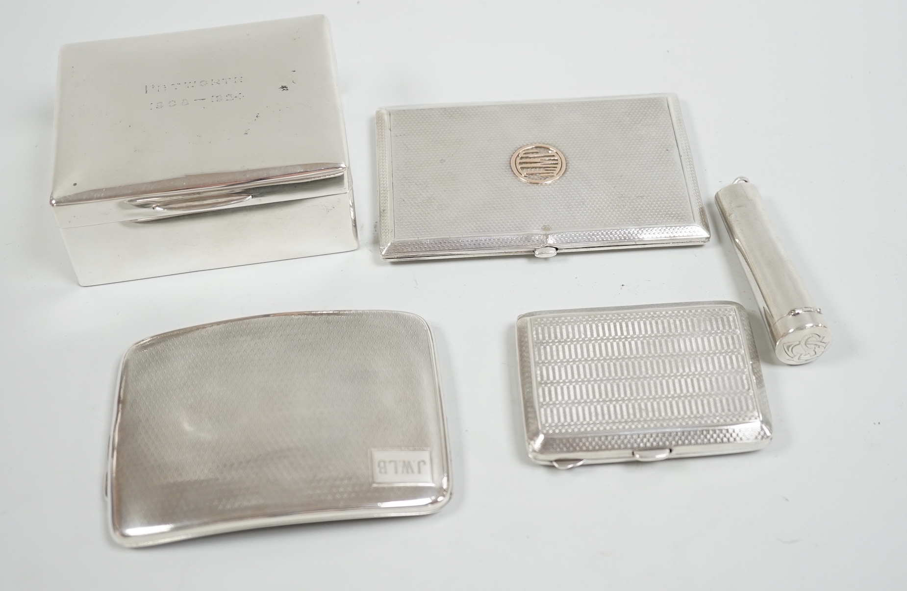 A George V silver mounted cigarette box, 10.5cm, three assorted engine turned silver cigarette cases and a silver cheroot case.